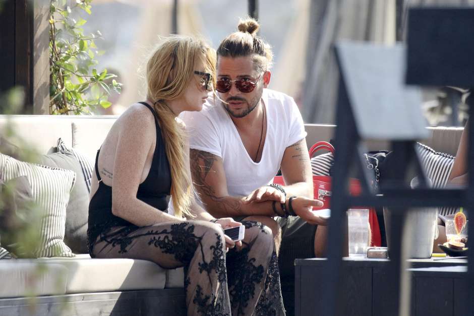 Photo © 2016 Mavrix Photo/The Grosby Group EXCLUSIVE!! Following the breakup of her engagement to Russian millionaire Egor Tarabasov it looks like Lindsay Lohan may have found romance again in the arms with good looking, heavily tattooed, long haired and wealthy beach bar restaurant owner Dennis Papageorgiou. Lohan has been spending most of her time at least on four separate days with Papageorgiou who owns Rakkan Mykonos after returning to the island where she spent her 30th birthday party at Rakkan with her ex-fiance Egor and which is also the sister property to Rakkan in Athens and is one of the hottest newly opened spots on the beach in Mykonos. A US magazine recently reported that “Lilo’s convinced it’s her destiny to marry a rich man". “She thought she was on to a winner with Egor, but instead of hiding away licking her wounds, she’s determined to get back out there and find her perfect Daddy Warbucks.” Greece, 27th August 2016.