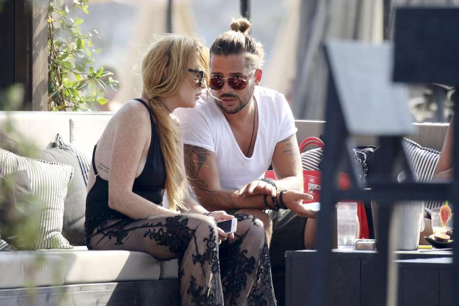 Photo © 2016 Mavrix Photo/The Grosby Group EXCLUSIVE!! Following the breakup of her engagement to Russian millionaire Egor Tarabasov it looks like Lindsay Lohan may have found romance again in the arms with good looking, heavily tattooed, long haired and wealthy beach bar restaurant owner Dennis Papageorgiou. Lohan has been spending most of her time at least on four separate days with Papageorgiou who owns Rakkan Mykonos after returning to the island where she spent her 30th birthday party at Rakkan with her ex-fiance Egor and which is also the sister property to Rakkan in Athens and is one of the hottest newly opened spots on the beach in Mykonos. A US magazine recently reported that “Lilo’s convinced it’s her destiny to marry a rich man". “She thought she was on to a winner with Egor, but instead of hiding away licking her wounds, she’s determined to get back out there and find her perfect Daddy Warbucks.” Greece, 27th August 2016.