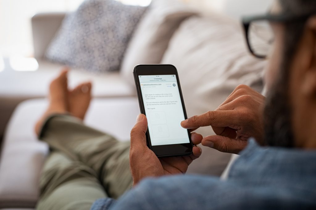 Man Reading Email On Smartphone