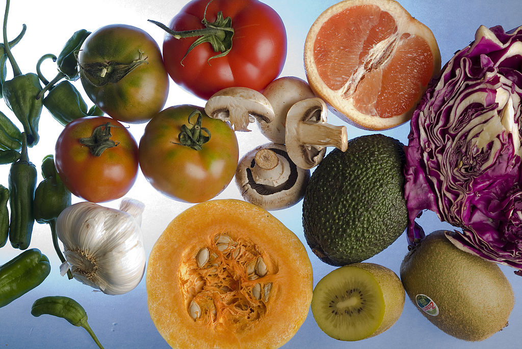 Several Vegetables And Fruits: Grapefruit, Cabbage, Peppers, Tomatoes, Avocados, Squash, Garlic Mushrooms And Kiwis.