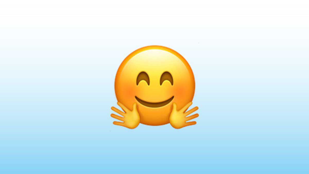 ¿Qué significa el emoji de la cara con manos abrazando en WhatsApp?