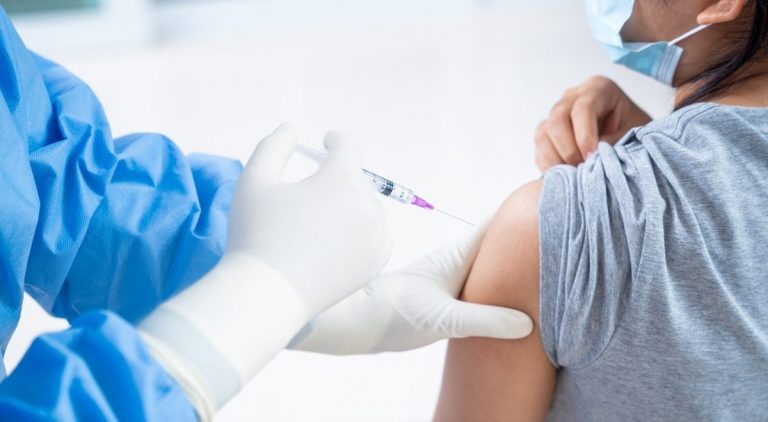 Doctor Making A Vaccination In The Shoulder Of Patient Teens Girls Person, Flu Vaccination Injection On Arm, Coronavirus,covid 19 Vaccine Disease Preparing For Human Clinical Trials Vaccination Shot